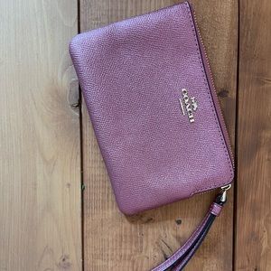 Enjoy a night out on the town with this fun and flirty Coach wristlet ✨
